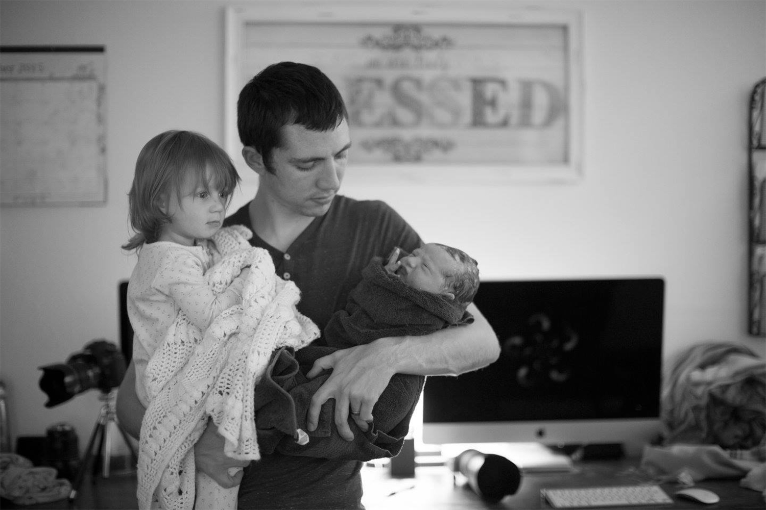 Business Owner holding children