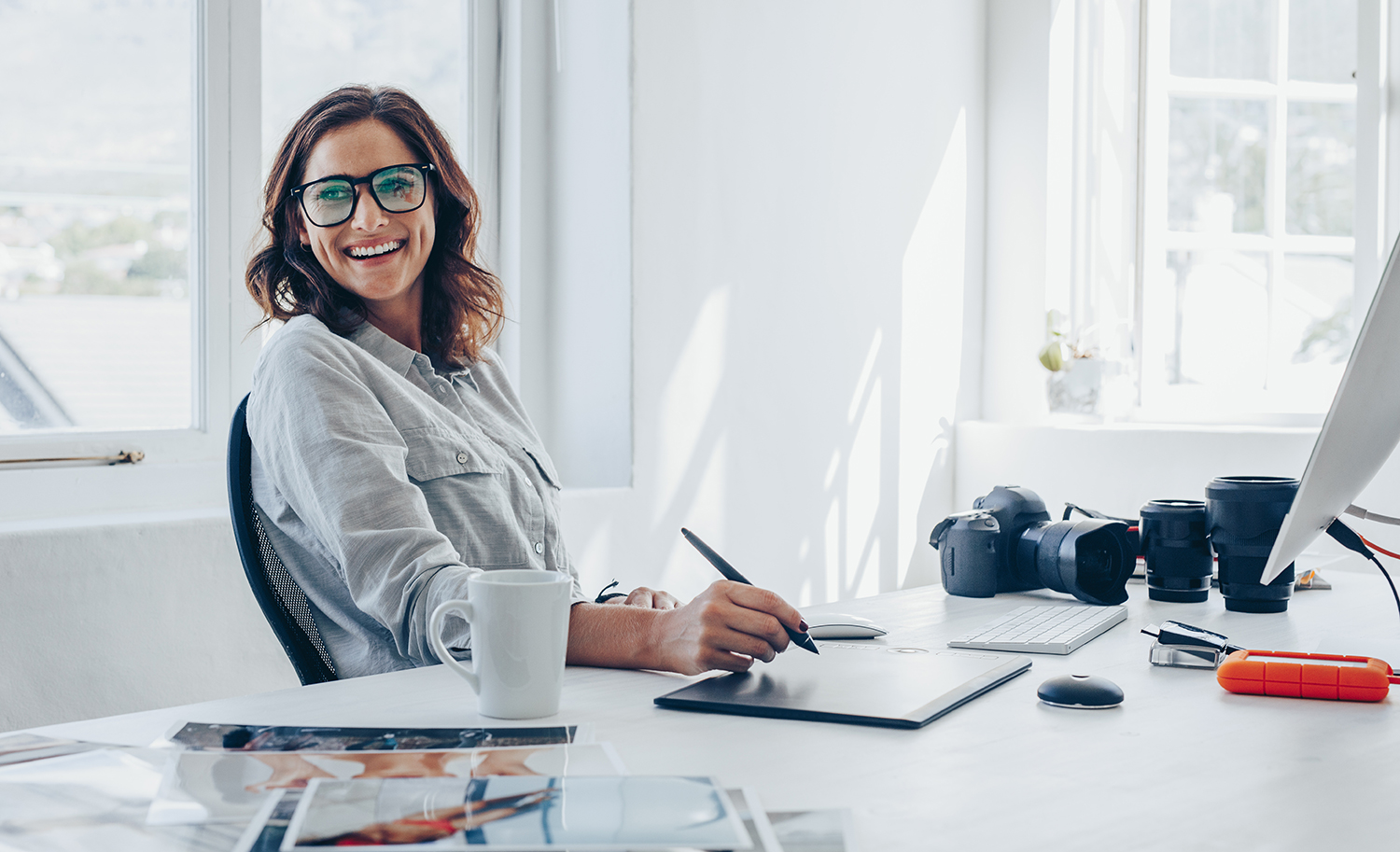 Photographer sitting at computer